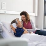 Daughter visiting mother in hospital