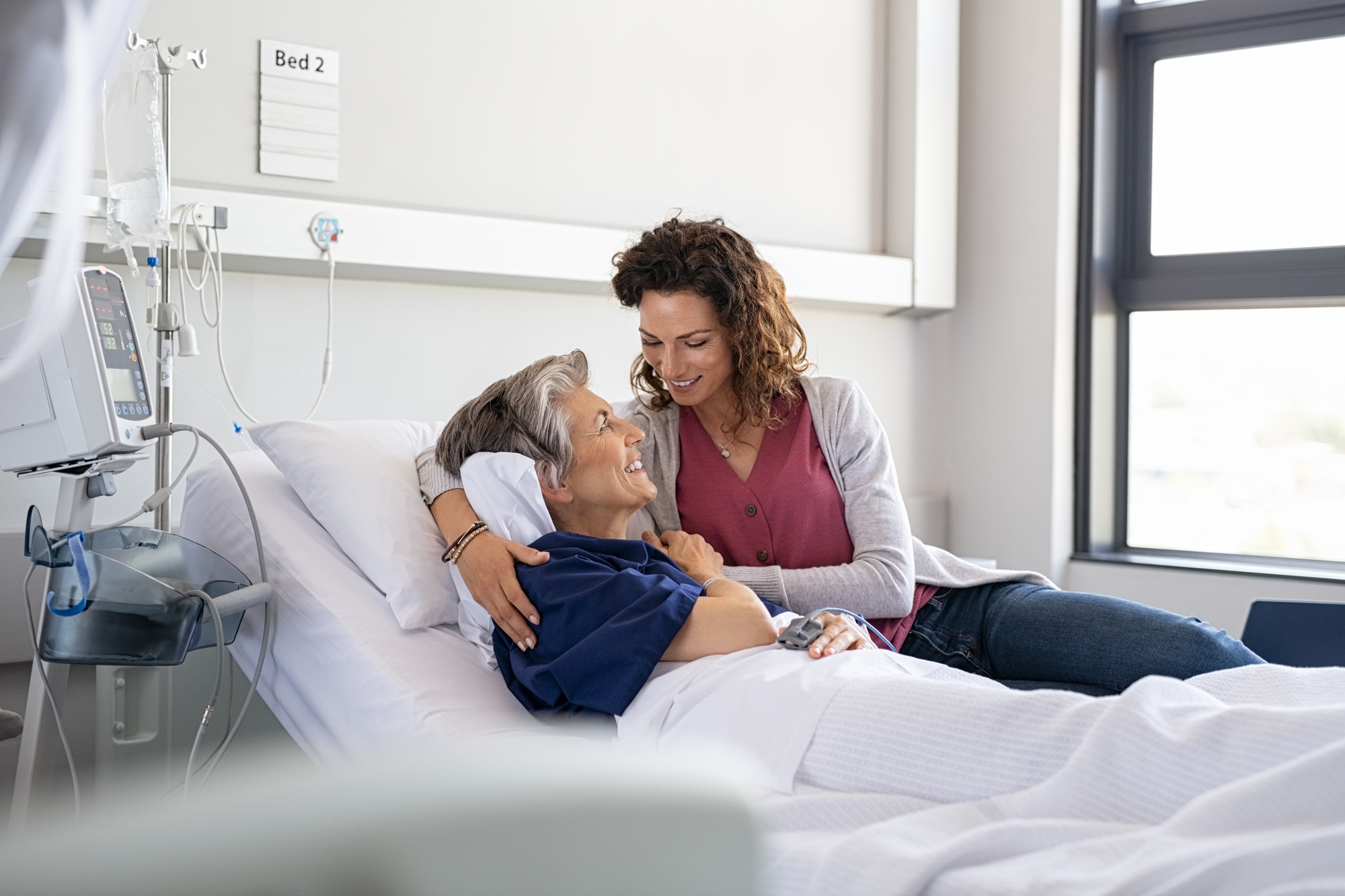 Daughter visiting mother in hospital